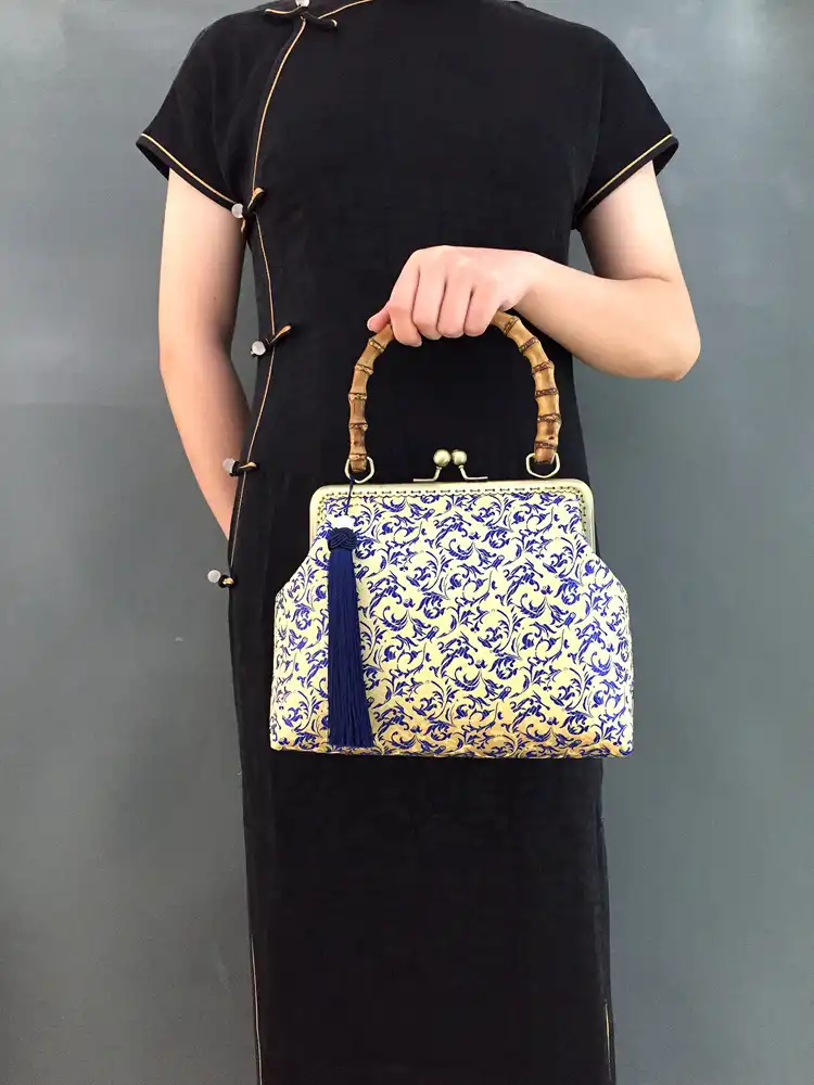Traditional Chinese floral pattern detail on embroidered satin surface.