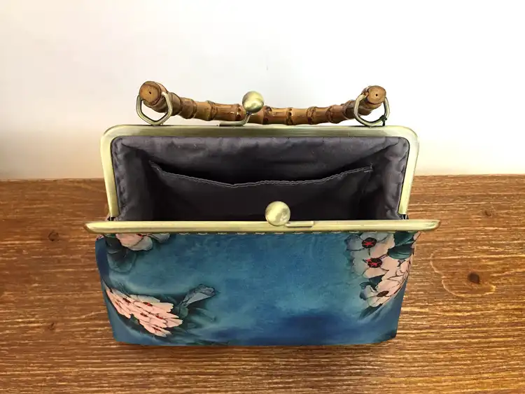 Evening event styling showing clutch paired with formal attire.