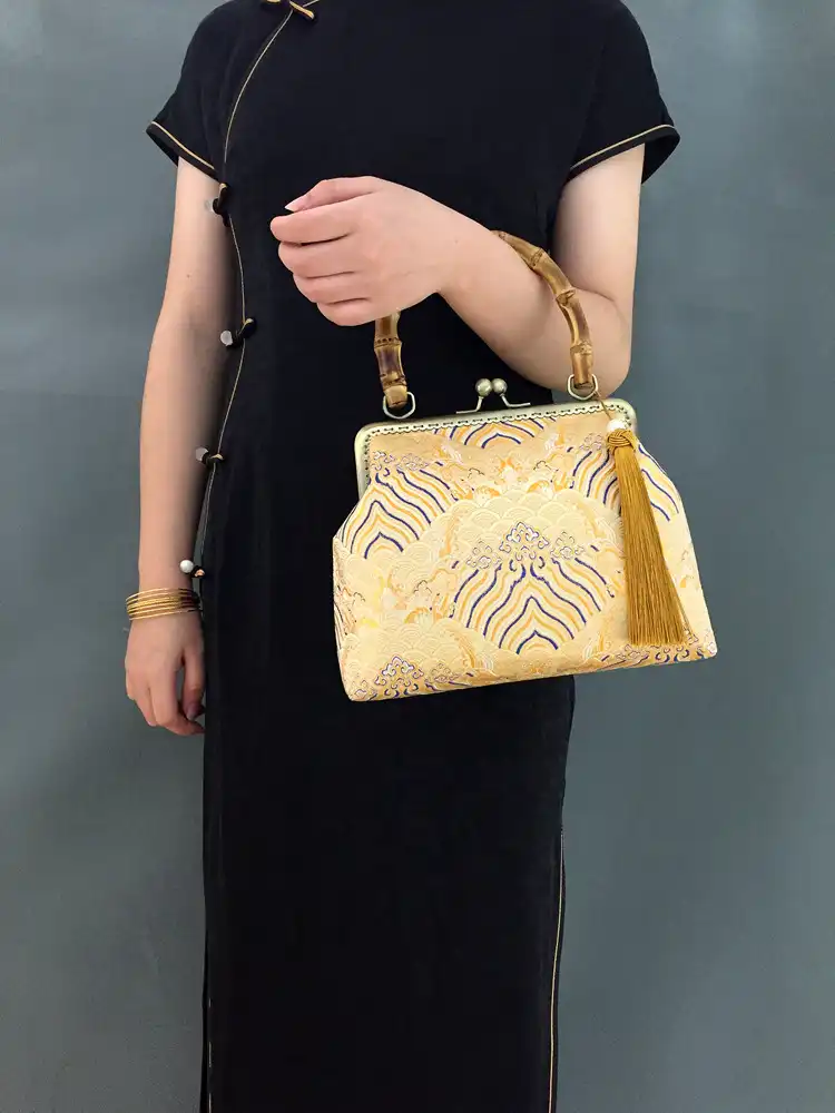 Cultural celebration context with embroidery bag as fashion accessory.