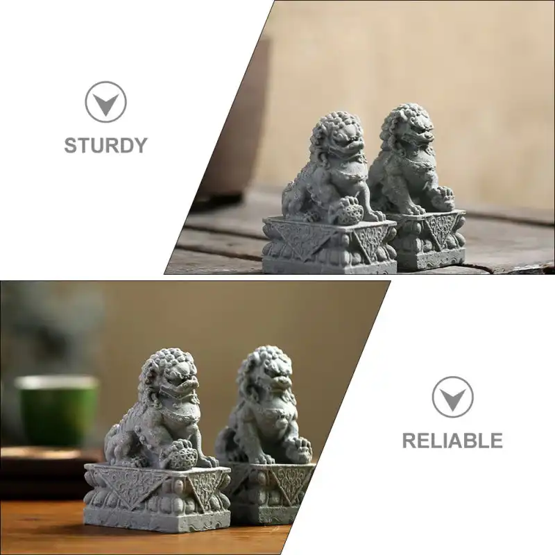 Close-up view of small grey lion figurine showing detailed craftsmanship and facial features.