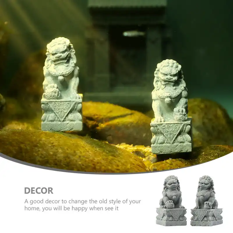 Two miniature lion sculptures positioned on modern desk demonstrating scale and placement.