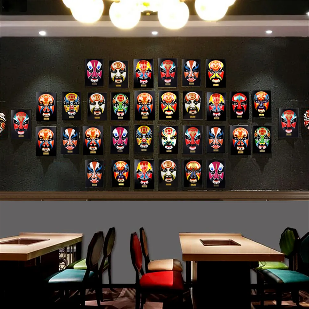 Multiple Chinese facial makeup ornaments collection showing variety of traditional character designs.