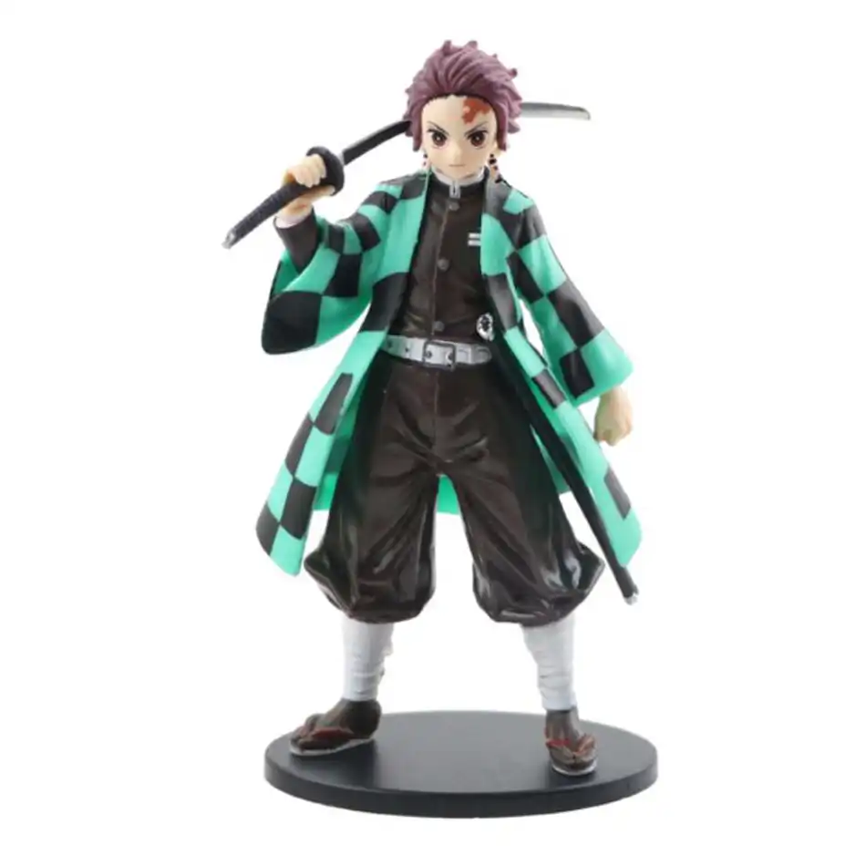 Demon Slayer anime figures trio, displayed together on desk..
