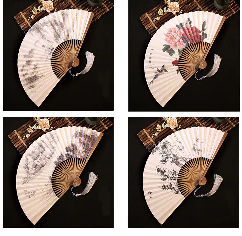 Model holding classical paper fan demonstrating proper grip and traditional Japanese styling.