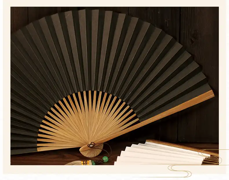 Classical Japanese paper folding fan opened showing 30 bamboo ribs and traditional Xuan paper covering.