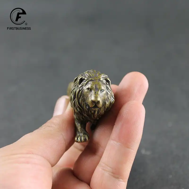 Chinese lion statue bronze foo dog miniature front view showing detailed facial features.