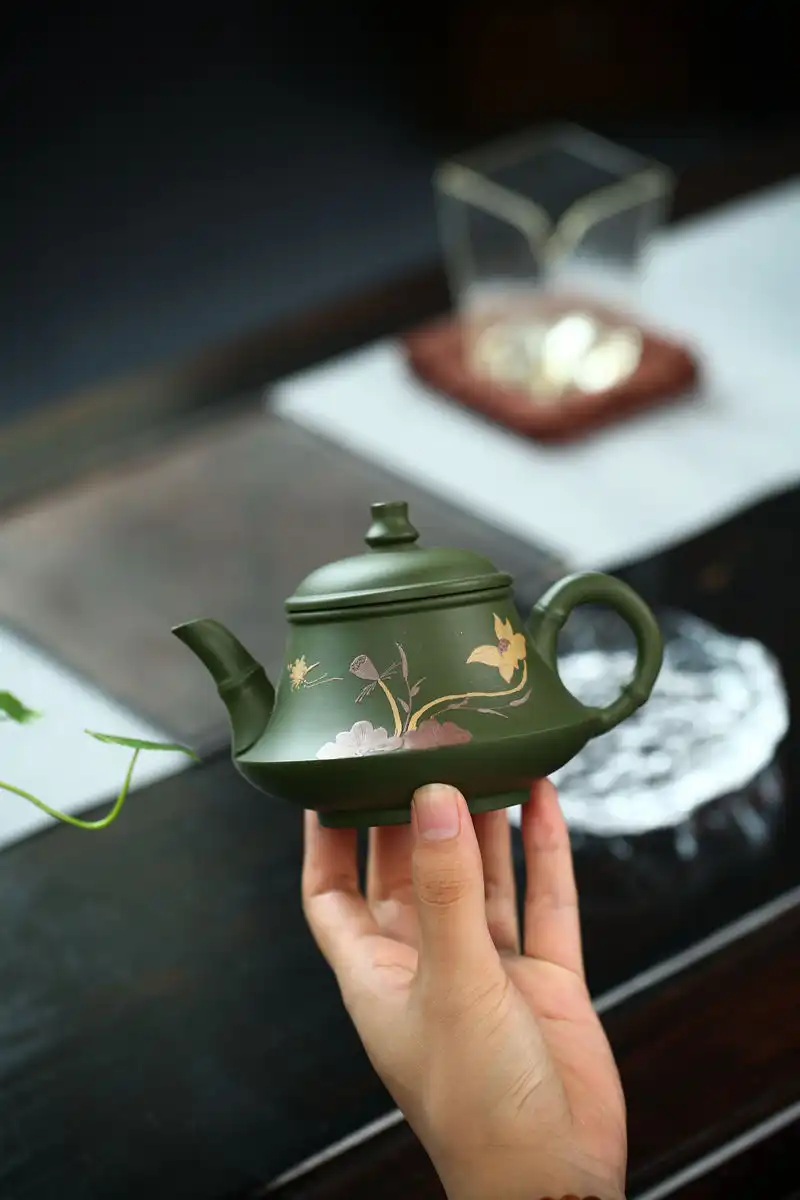 Travel-friendly 230ml green mud teapot demonstrating compact size and convenient portability.
