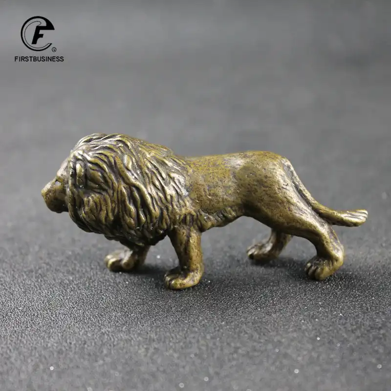 Bronze guardian lion statue showing antique patina finish and texture details.