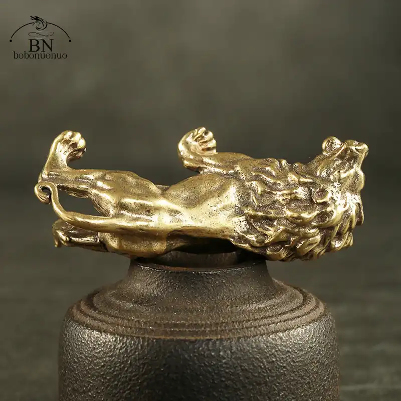 Close-up view of lion figurine highlighting intricate mane texture and facial expression details.