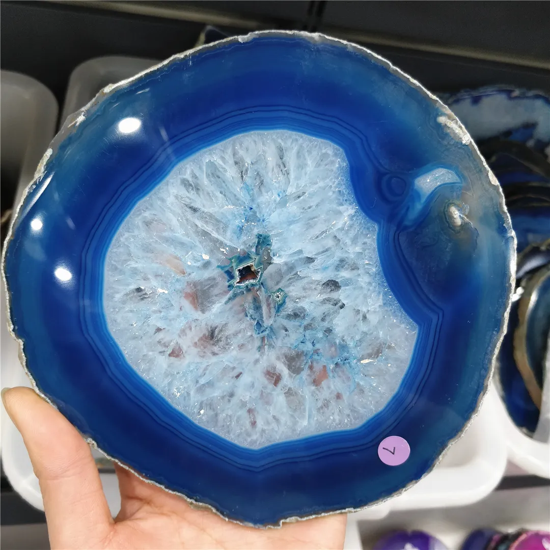 Blue agate coasters in use as table protection under cups showing practical home decoration.