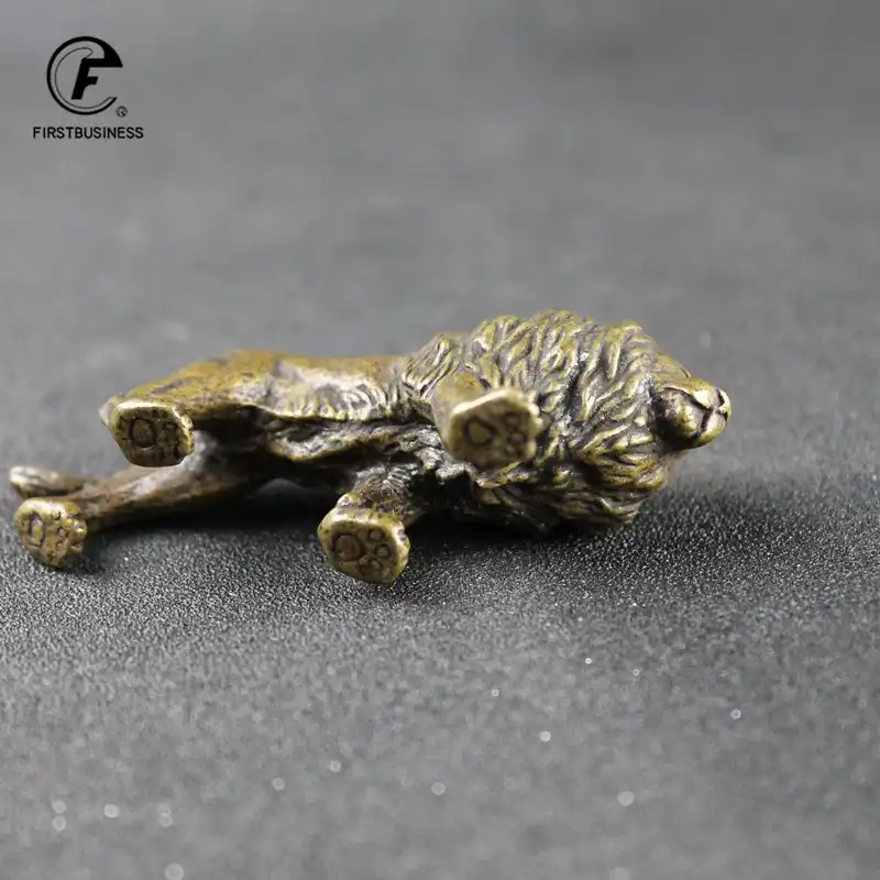 Antique copper lion figurine side angle displaying intricate mane and body craftsmanship.