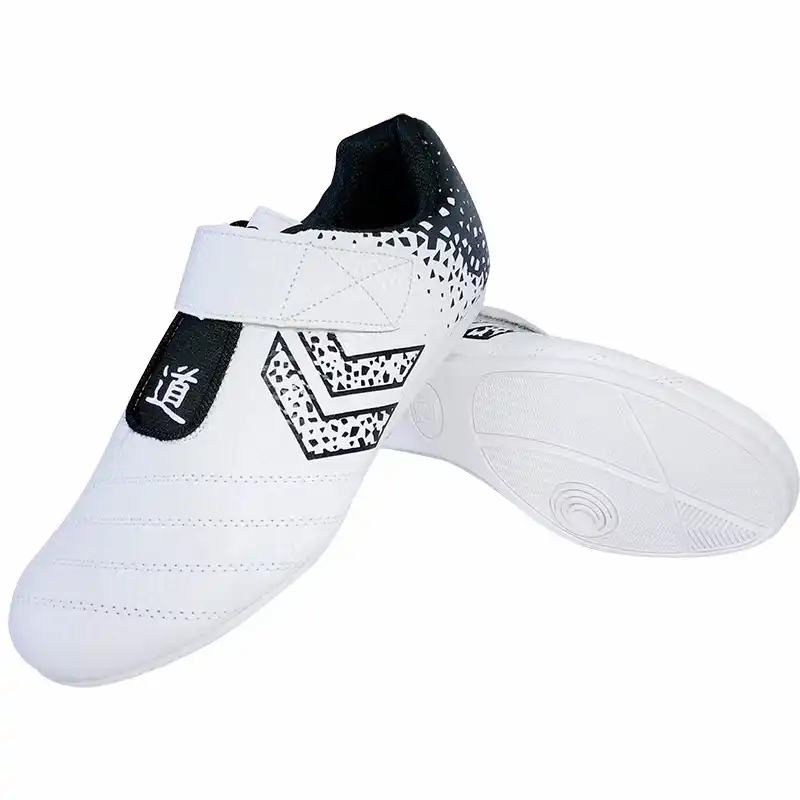 Close-up of taekwondo shoe sole displaying durable rubber outsole with traction design for stability.