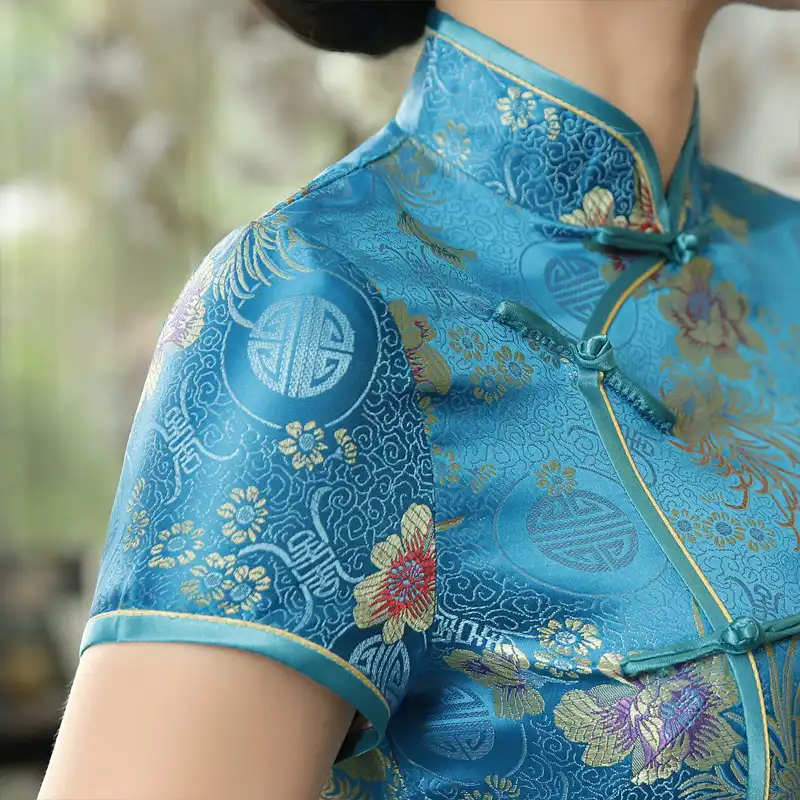 Green cheongsam wedding dress paired with traditional accessories for complete formal look.