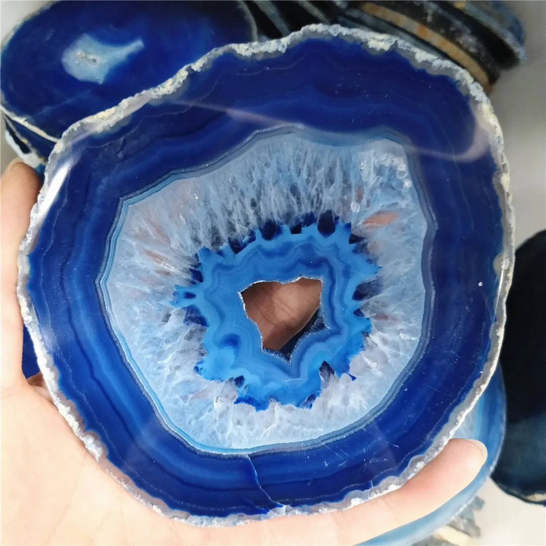 Collection of blue agate mineral specimens arranged as vintage folk art home decoration display.
