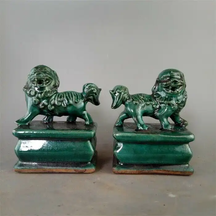 Green glaze porcelain foo dog statue bottom view showing 7.5cm diameter base and quality ceramic construction.