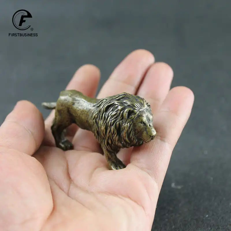 Close-up of bronze lion statue face revealing fine artistic details and expression.