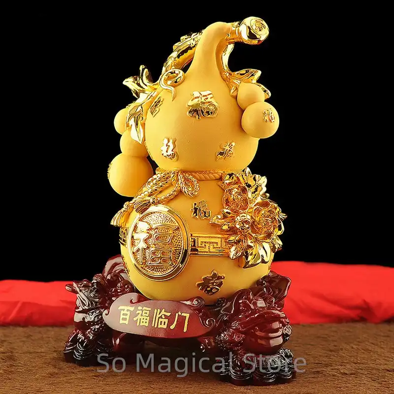 Size comparison of 21.5x15x13cm golden feng shui gourd with measurement ruler.