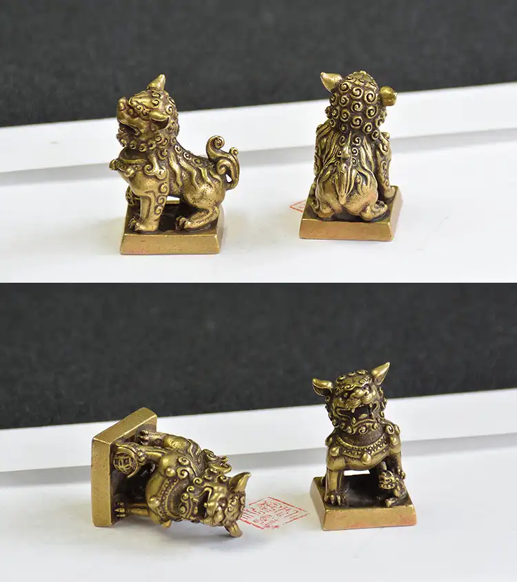 Close-up detail of miniature copper lion figurine showing fine craftsmanship and antique finish.
