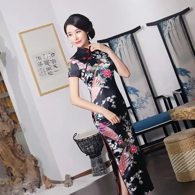 Purple satin long cheongsam with floral print patterns and ankle-length traditional design.