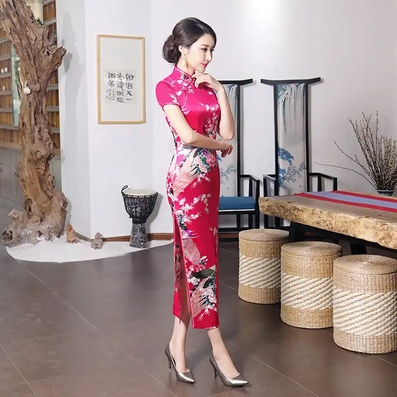Model in purple cheongsam showing comfortable movement and ease of wear.