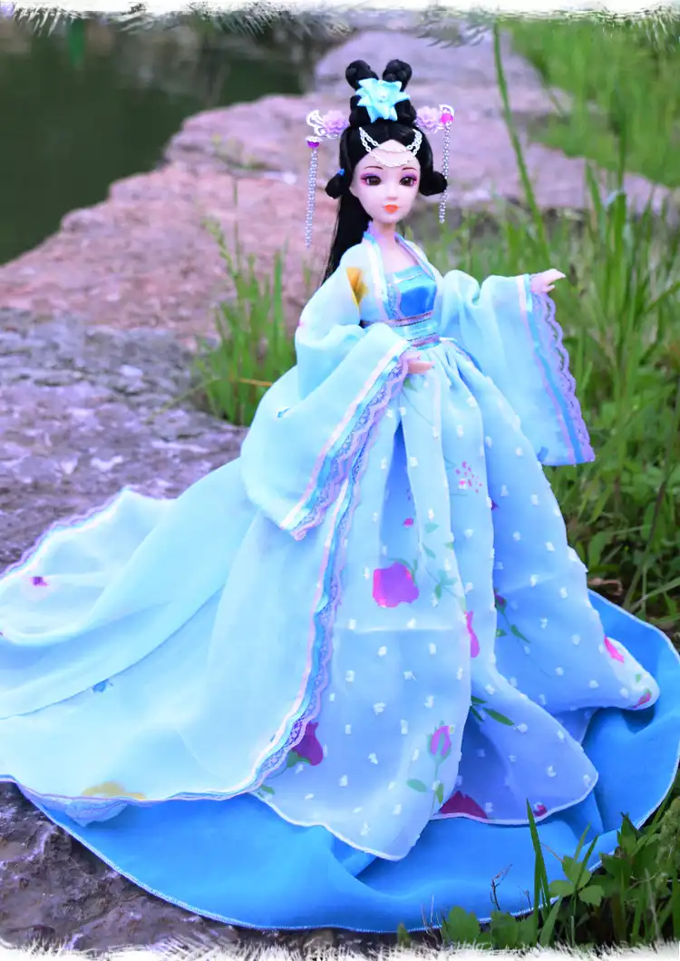 Close up of doll hair styling showing traditional imperial concubine hairstyle.