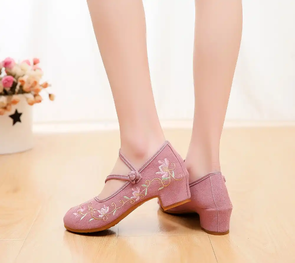 Block heel construction from side angle displaying square heel stability and comfort.