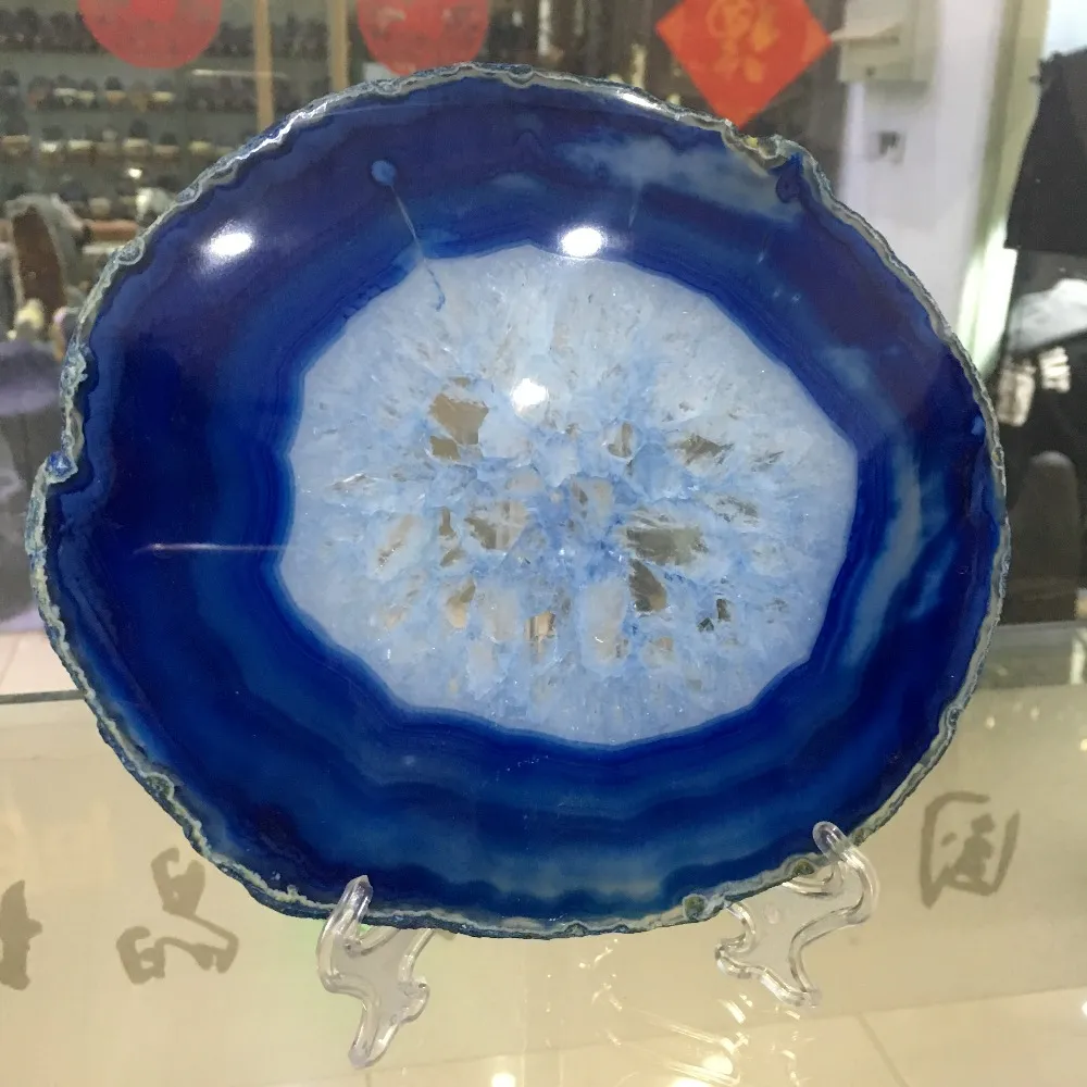 Close-up detail of blue agate geode crystalline formations and vibrant mineral colors.