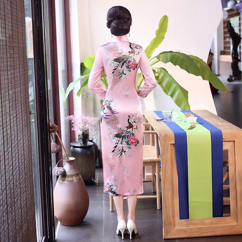 Model wearing purple qipao in autumn setting demonstrating multi-season wearability.