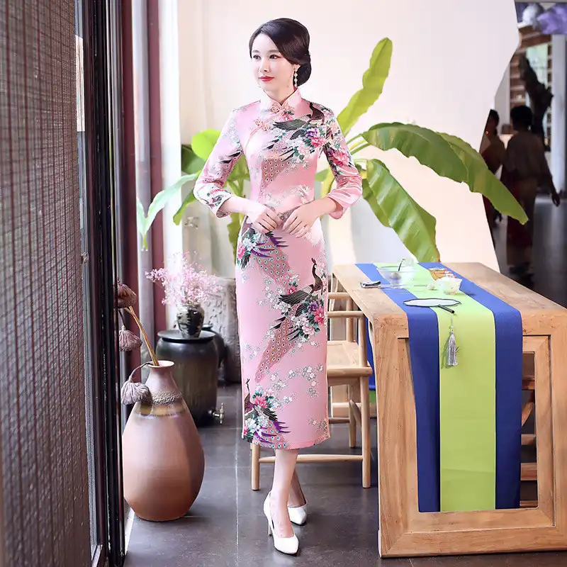 Model wearing elegant purple qipao showing Mandarin collar and handmade button details.