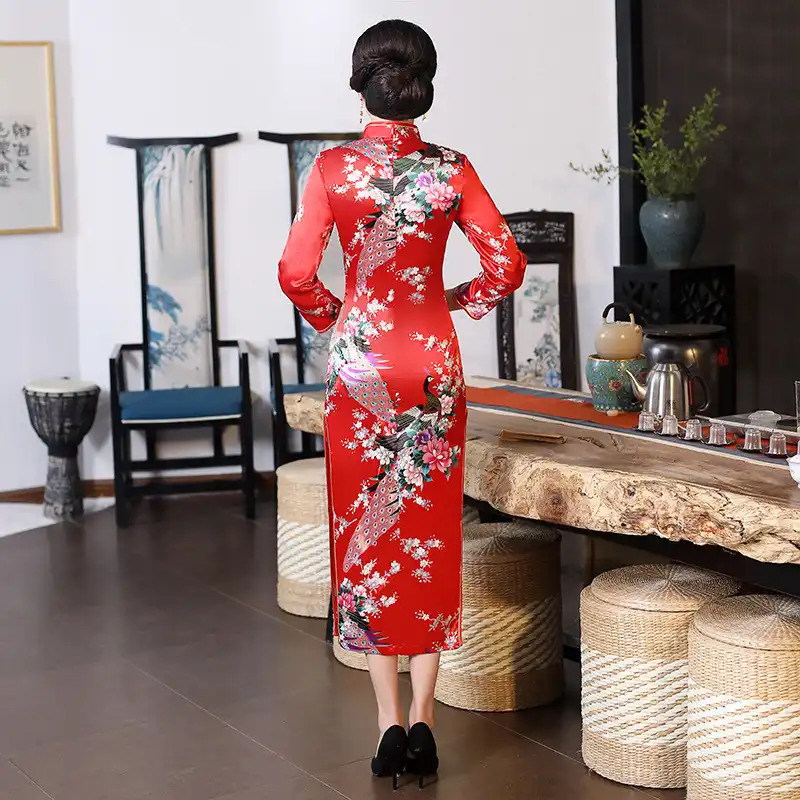 Close-up detail of floral print pattern on premium satin polyester rayon fabric texture.