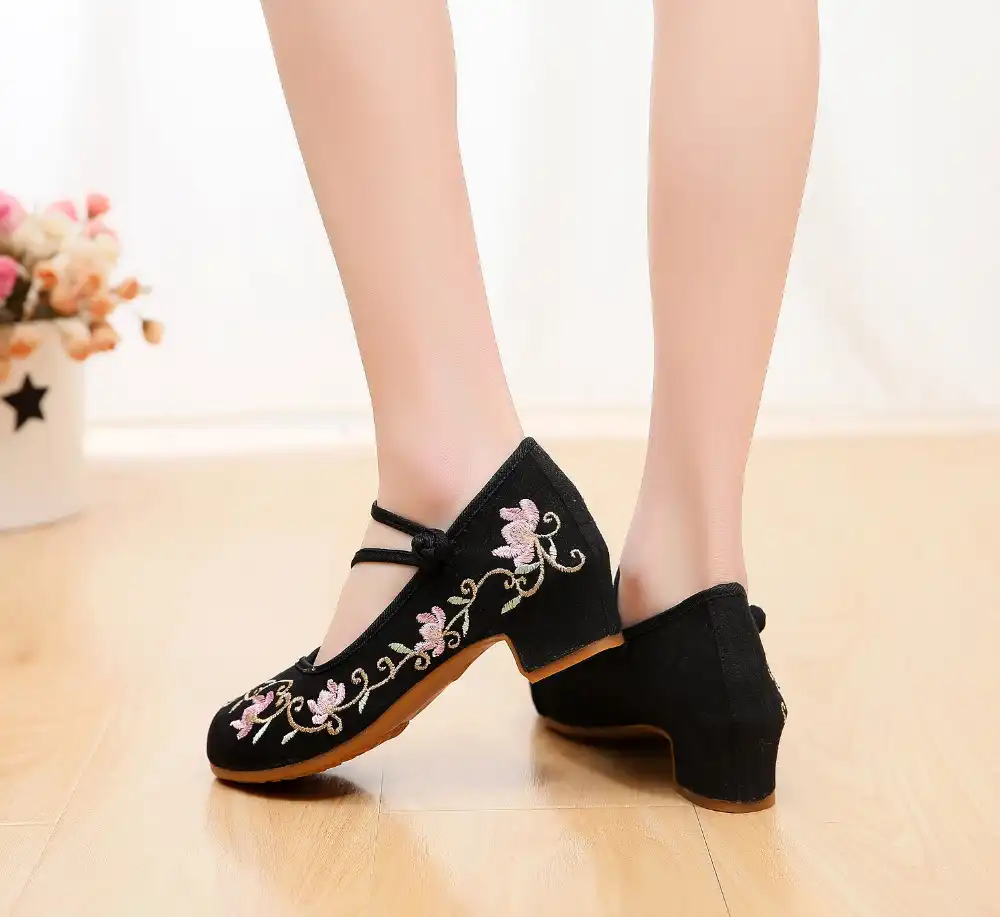 Old Beijing style canvas shoes displaying ethnic print pattern and traditional aesthetics.