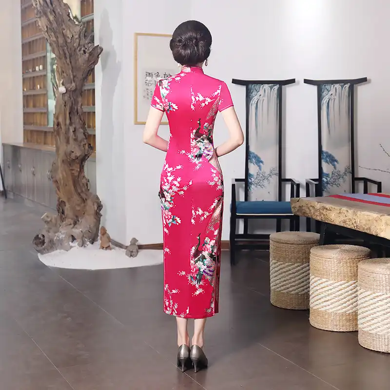 Model in purple cheongsam for summer occasion showing breathable fabric benefits.