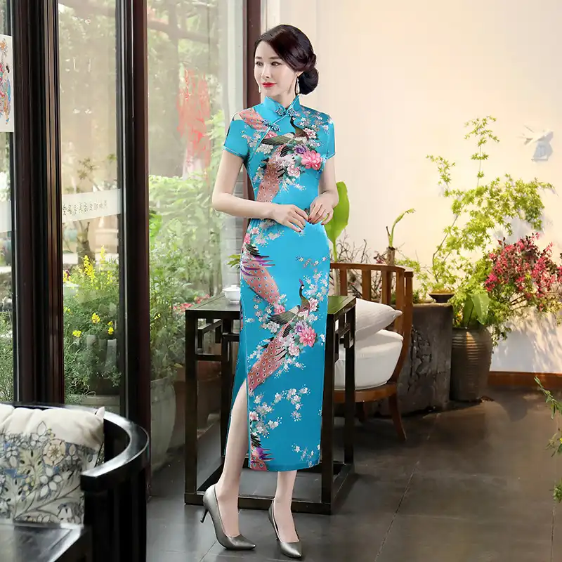 Purple satin cheongsam dress styled with traditional accessories for complete look.