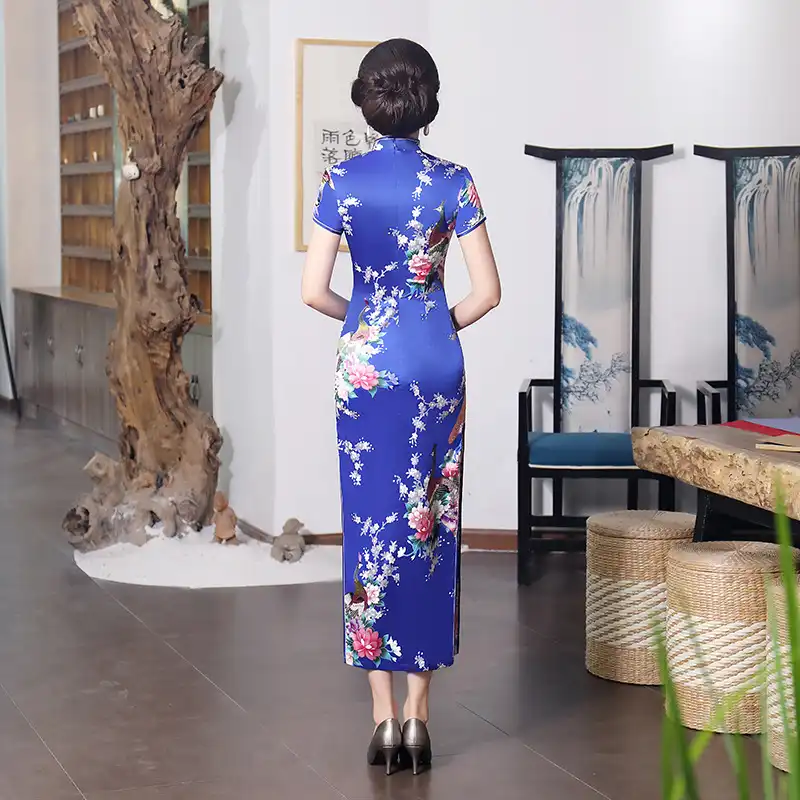 Close-up of Mandarin collar construction on purple cheongsam showing quality details.