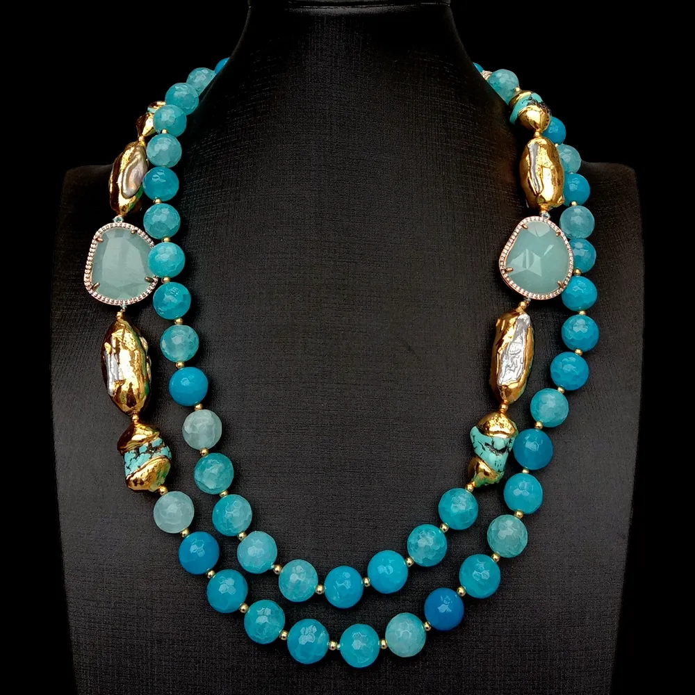Close-up view of blue faceted agate turquoise white Biwa pearl details with crystal accents.