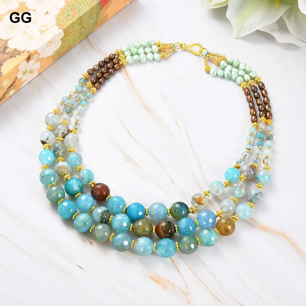18K gold plated clasp detail on multi strand blue agate brown pearl necklace.