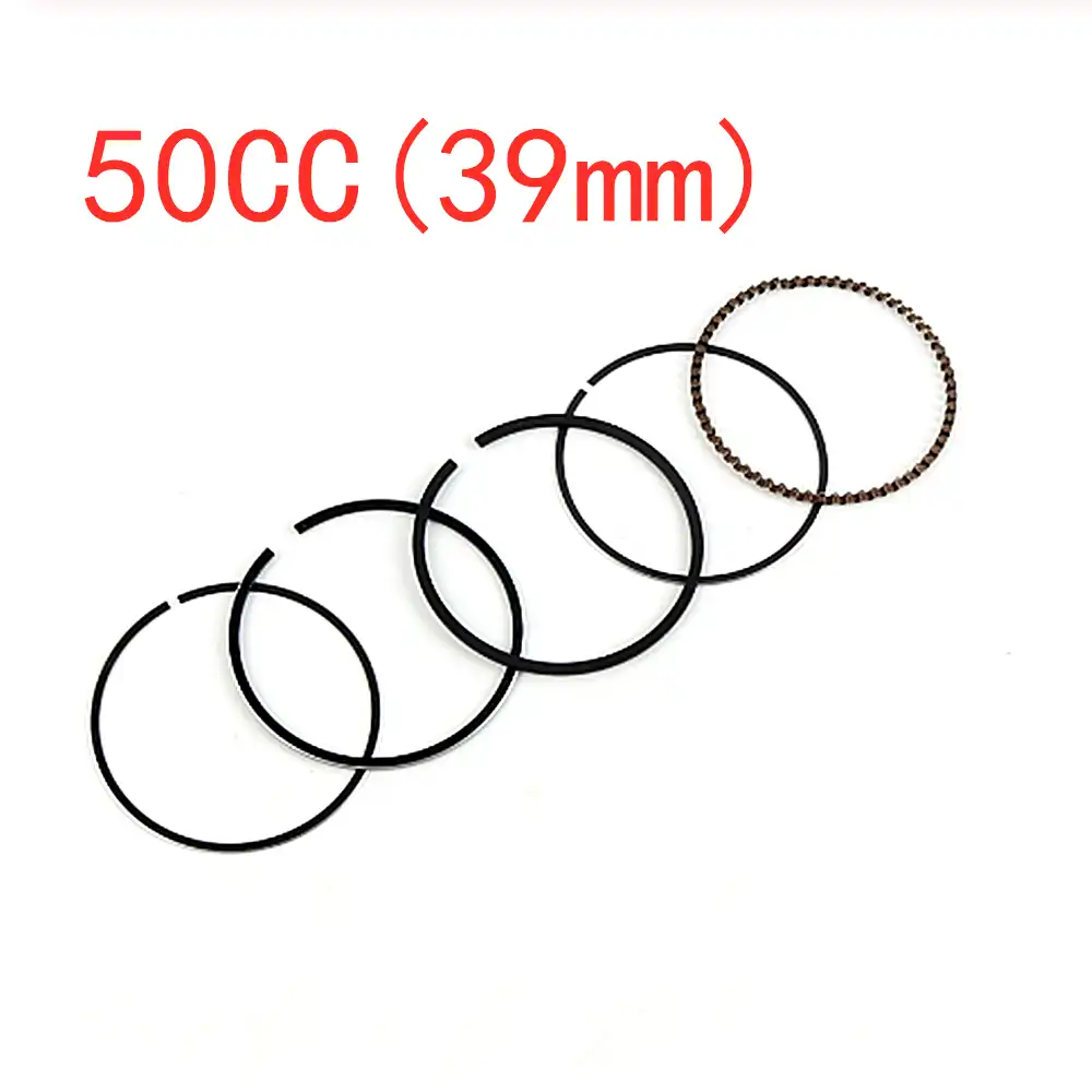 Installation process of GY6 piston rings in scooter ATV motorcycle engine cylinder.