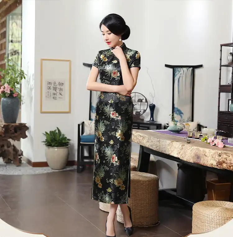 Model wearing elegant green qipao wedding dress showing classic Chinese design and fit.