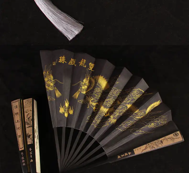 Professional portrait featuring gentleman with laser engraved bamboo folding fan.