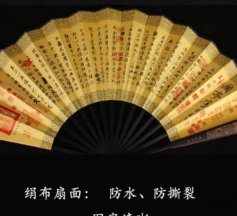 Masculine styling of large folding fan positioned as sophisticated gentleman accessory.