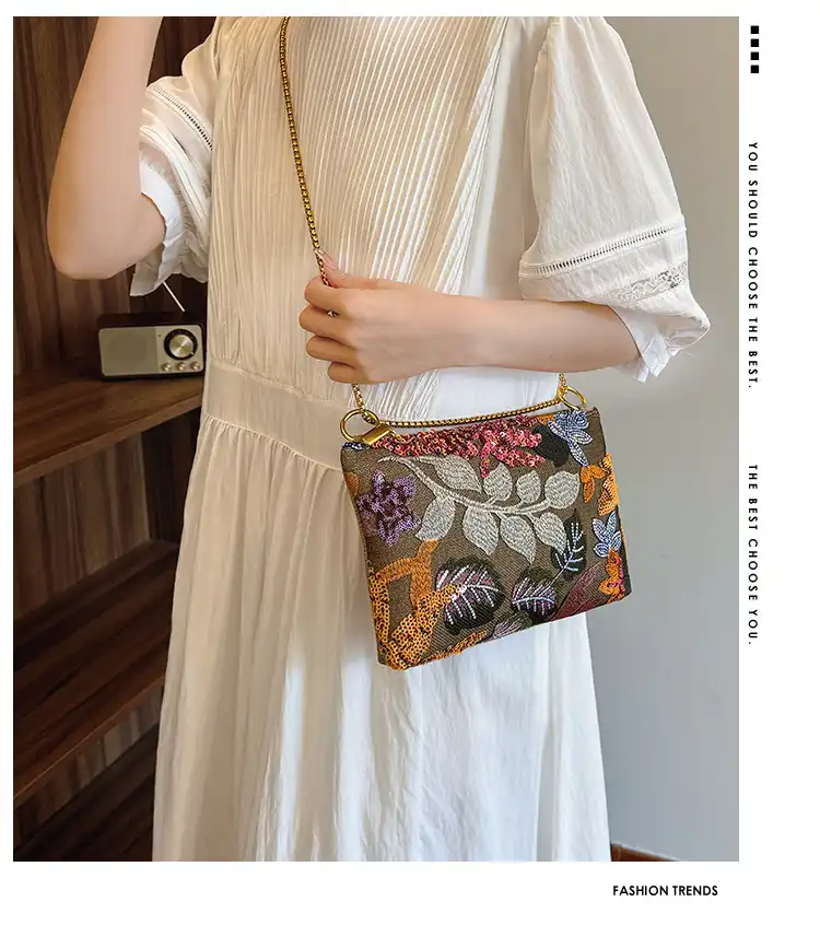 Sequined embroidery clutch bag with chain strap showcasing sparkling details and square linen design.