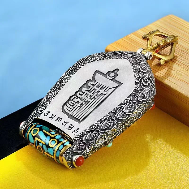 Men's Buddhist rotating Thangka pendant necklace with Yellow God of Wealth copper design.