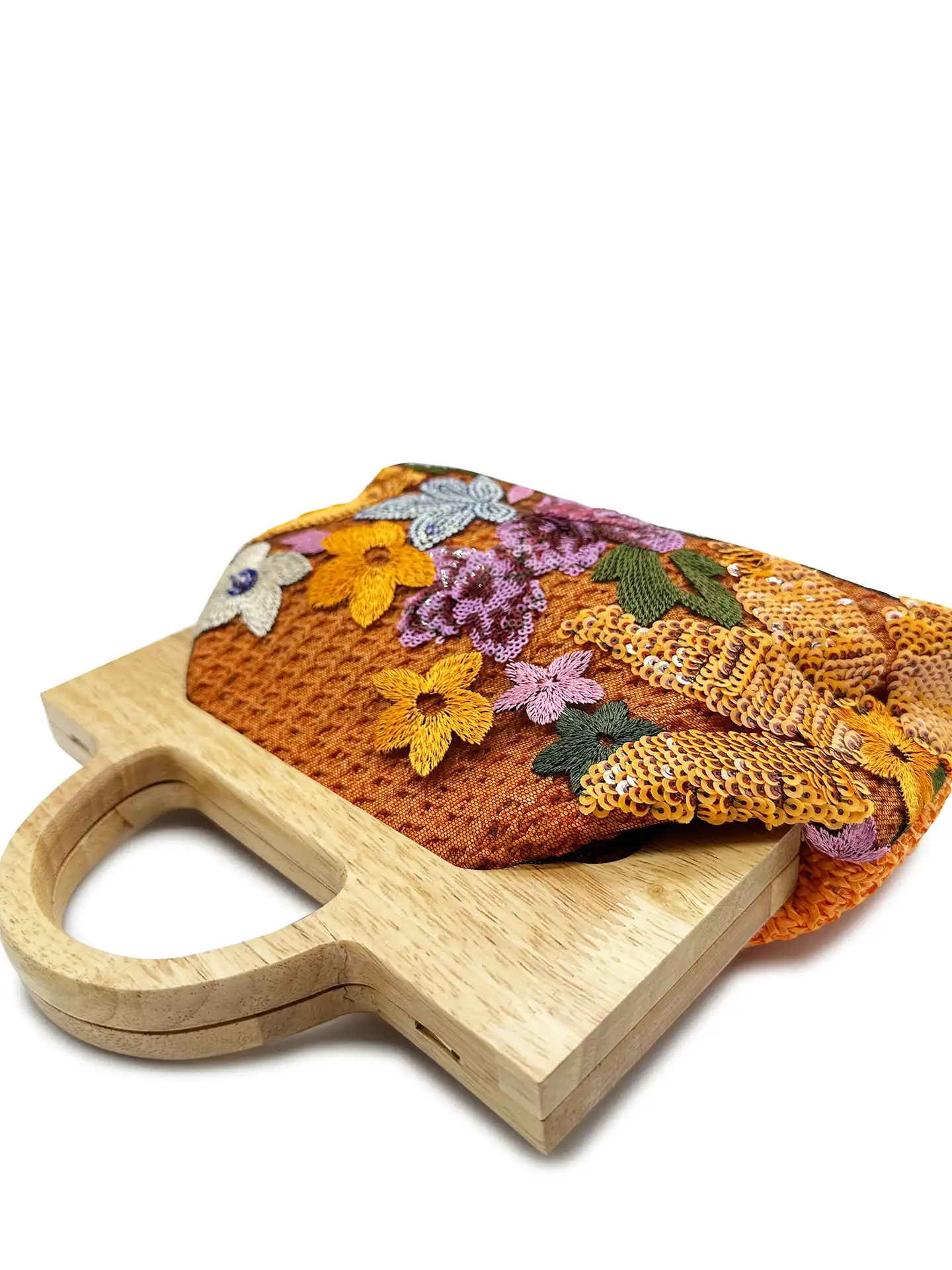 Wooden handle chain clutch displayed from side angle highlighting unique shell silhouette and craftsmanship.
