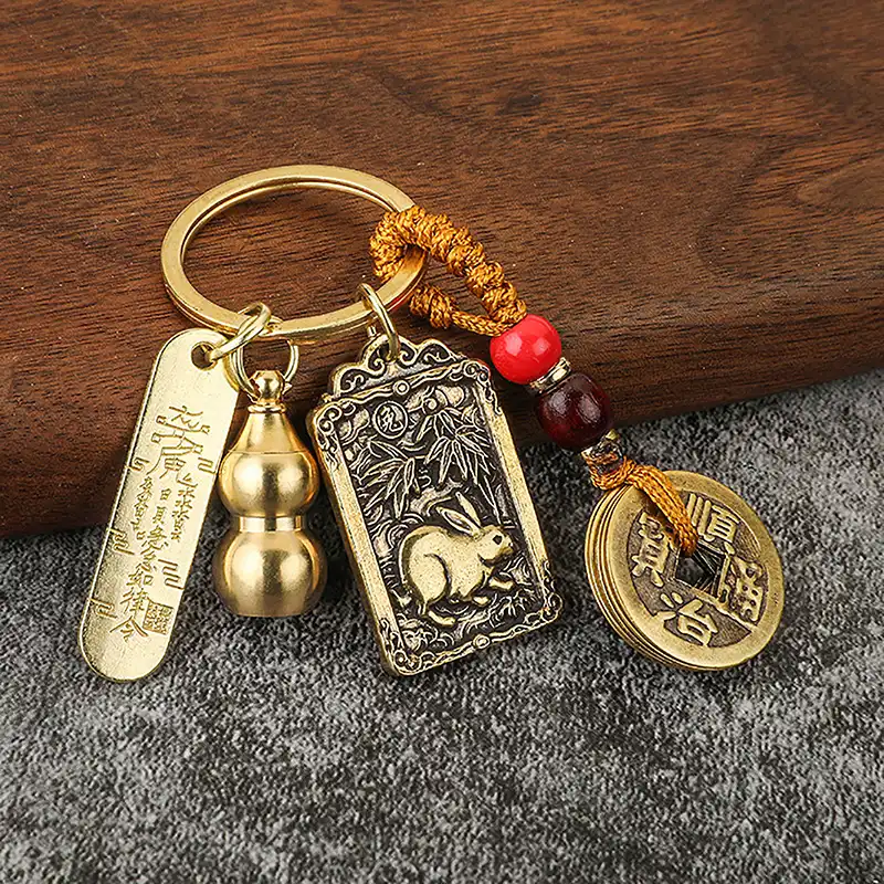 Chinese zodiac five emperors money keychain with brass gourd design and traditional feng shui coins.