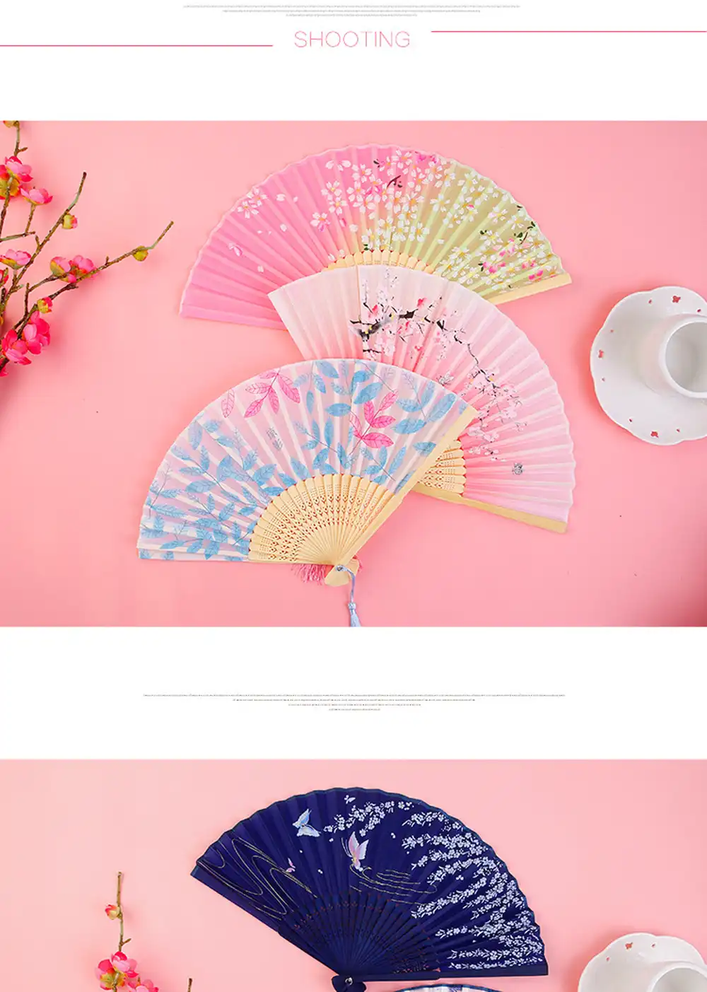 Closed black folding fan showing 21cm compact size with bamboo handle and tassel pendant.