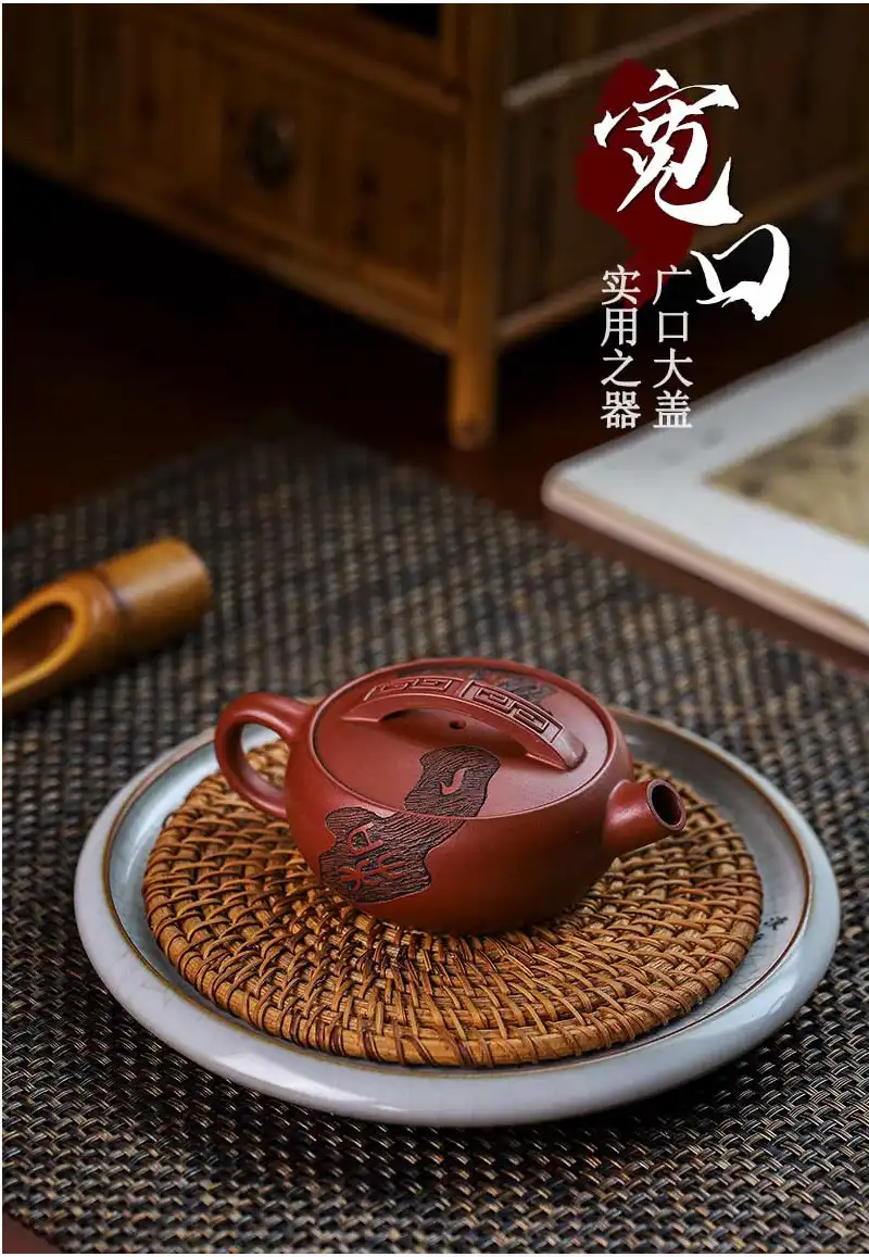 Authentic Yixing clay teapot brewing demonstration with golden tea color and clear liquid.