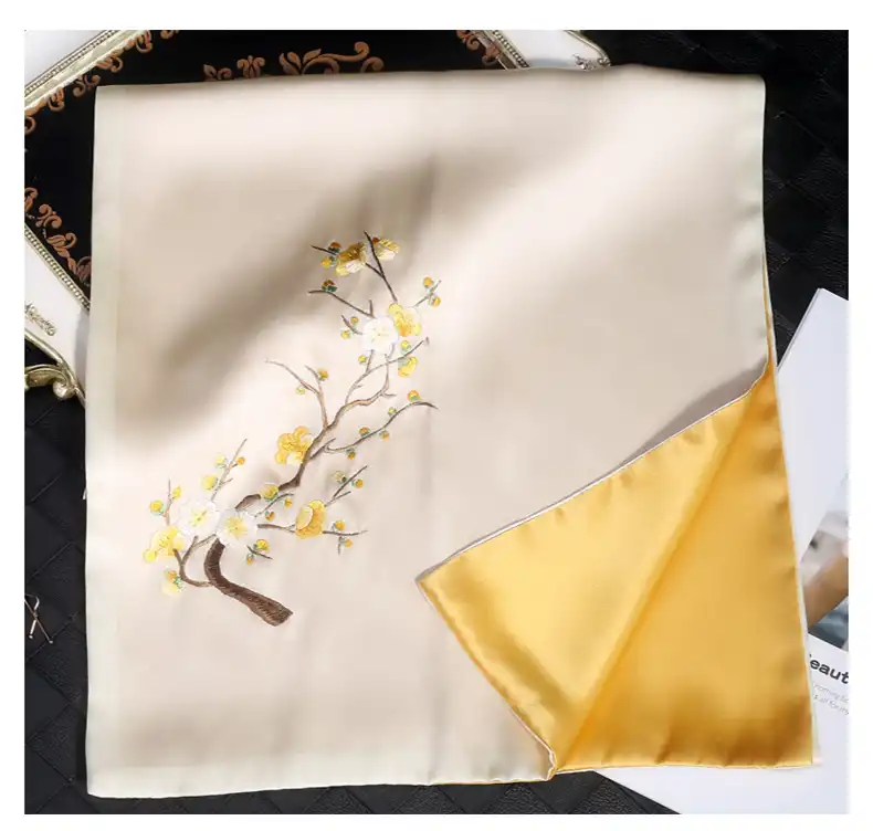 Handmade silk shawl draped elegantly showcasing traditional Chinese embroidery craftsmanship.