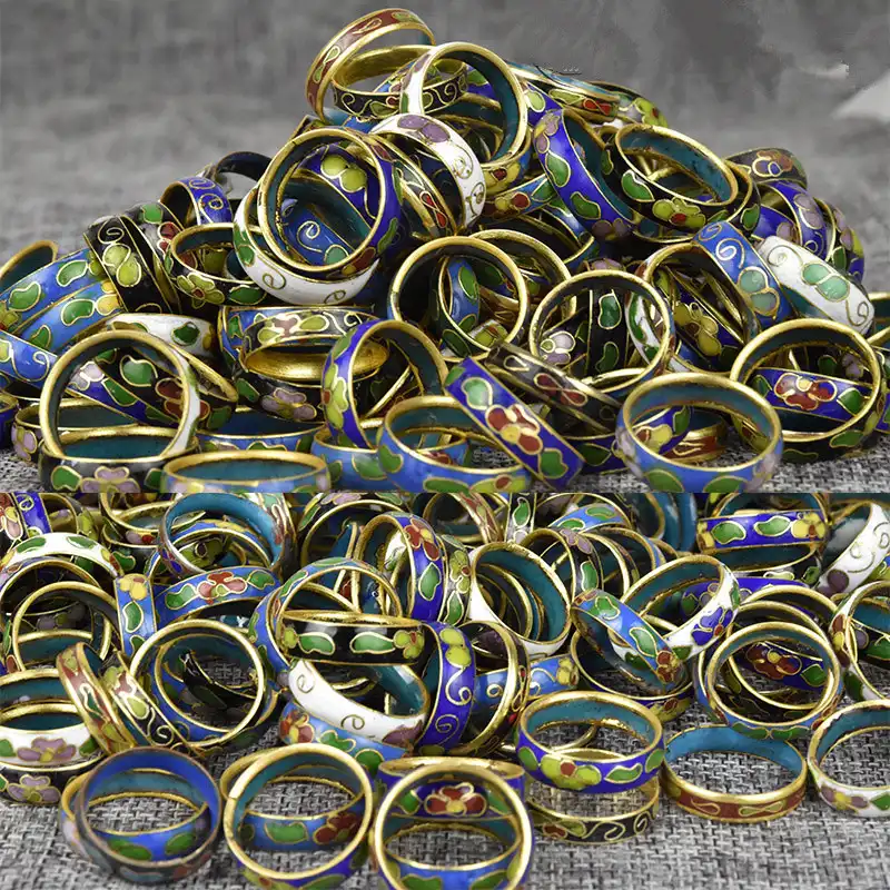 Close-up view of cloisonne ring enamel detail showing intricate wire compartment design.