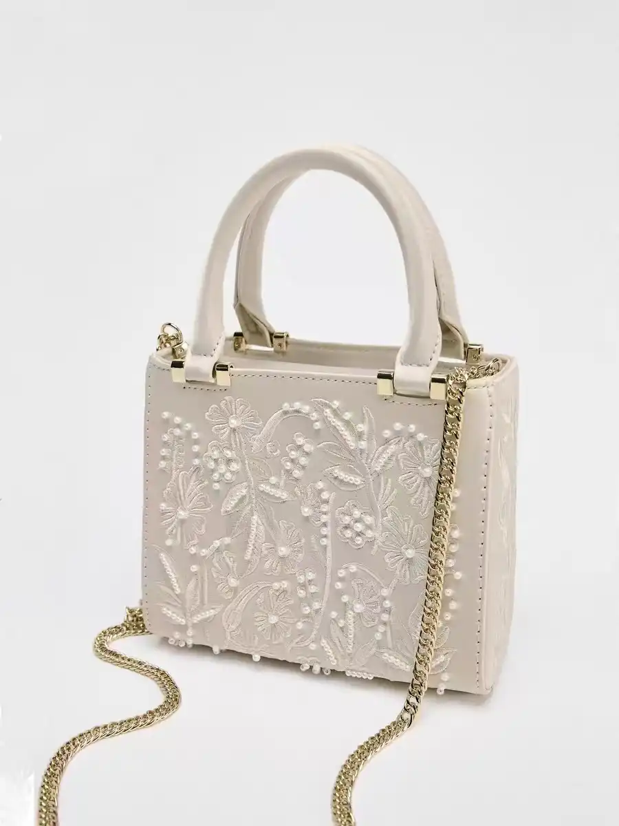 Elegant floral embroidery silk tote bag with intricate design details and premium quality finish.