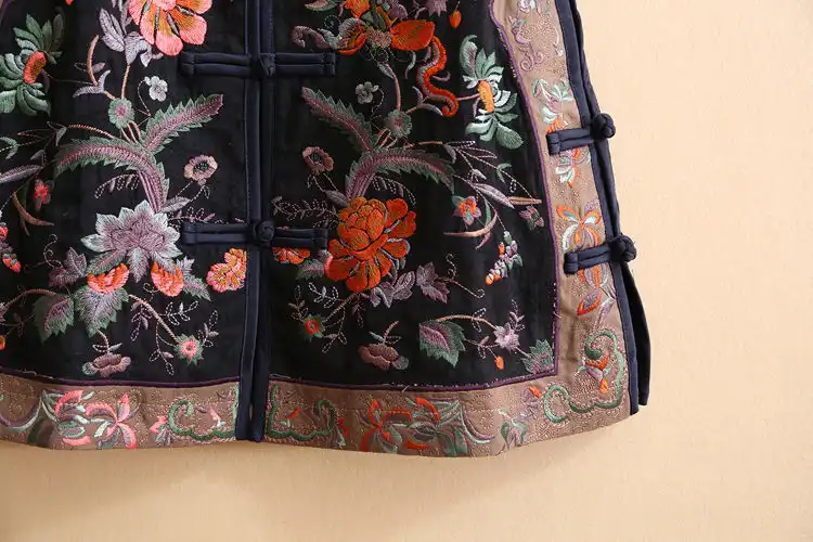 Model demonstrating versatile layering options with embroidered oriental vest.